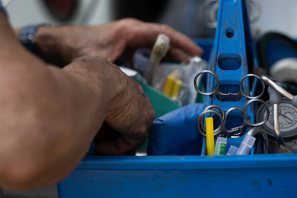 The field kit in the practice truck &mdash; stethoscope, shears, and syringes packed for the route